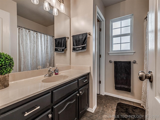 bathroom with tile patterned flooring and vanity