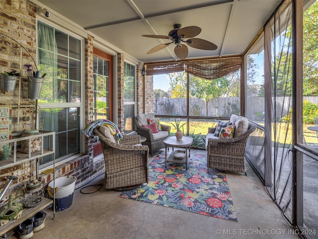 sunroom featuring ceiling fan