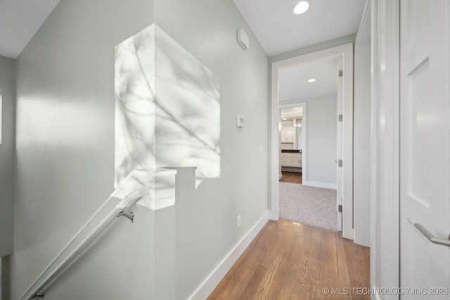 hallway with wood-type flooring