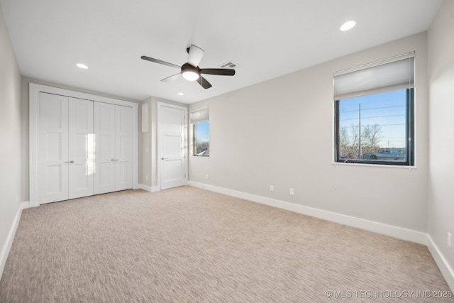 unfurnished bedroom with ceiling fan, recessed lighting, visible vents, baseboards, and carpet