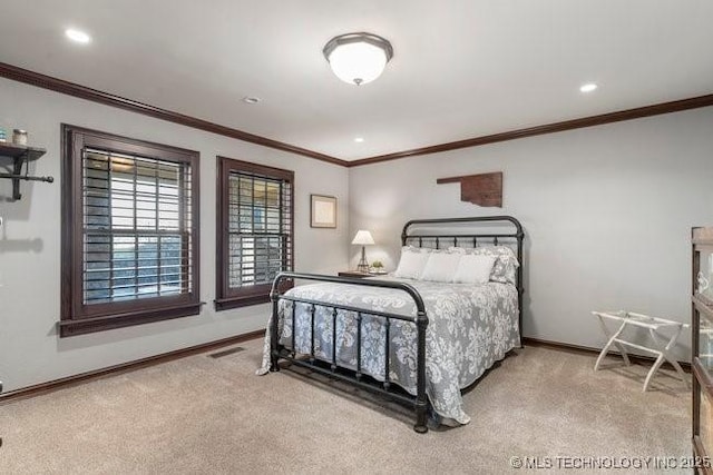 carpeted bedroom featuring crown molding