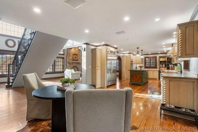 dining space featuring sink and light wood-type flooring