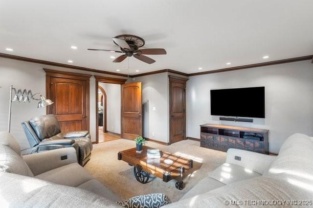 carpeted living room with ceiling fan