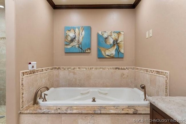 bathroom featuring vanity, tiled bath, and crown molding