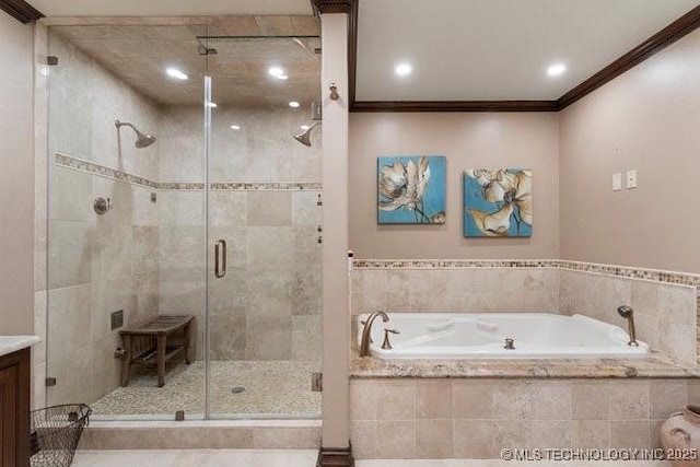 bathroom featuring vanity, ornamental molding, and shower with separate bathtub