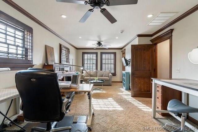 carpeted office space with ceiling fan and ornamental molding