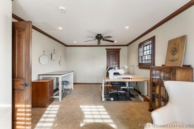 carpeted home office with crown molding and ceiling fan