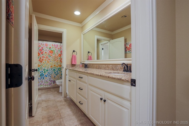 bathroom with ornamental molding, vanity, toilet, and tile patterned flooring