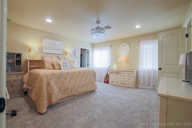 bedroom featuring light colored carpet