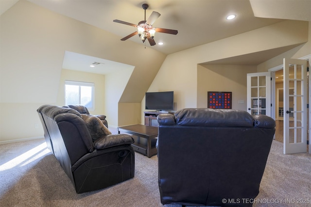 carpeted living room featuring french doors, ceiling fan, and vaulted ceiling