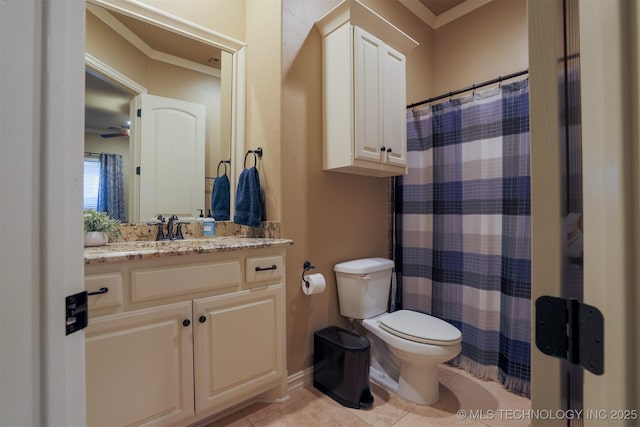 bathroom with crown molding, vanity, toilet, and tile patterned flooring