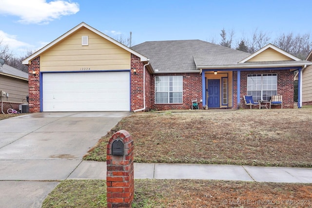 single story home with a garage and central AC