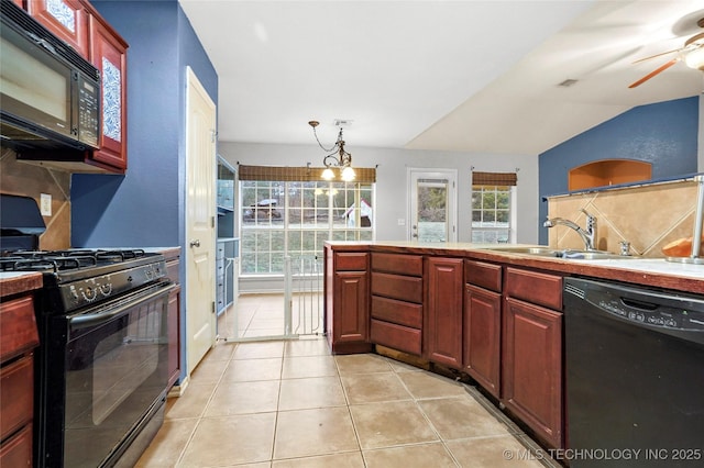 kitchen featuring light tile patterned floors, sink, ceiling fan, hanging light fixtures, and black appliances