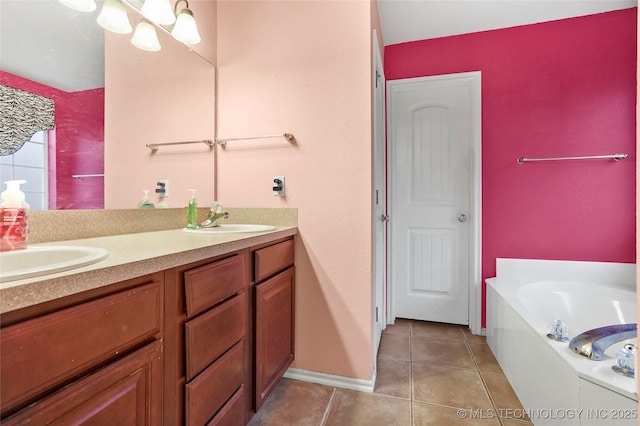 bathroom featuring vanity, a bath, tile patterned floors, and an inviting chandelier