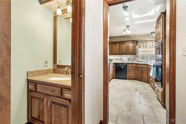 bathroom with vanity, tile patterned flooring, and decorative backsplash