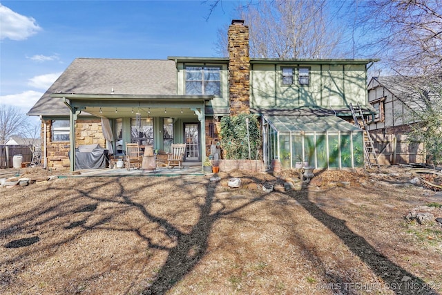 back of house with a patio