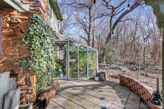 view of patio / terrace with an outbuilding