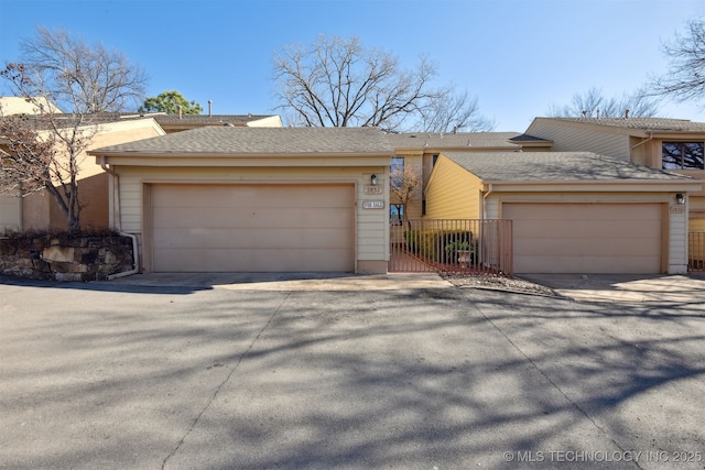 ranch-style home with a garage