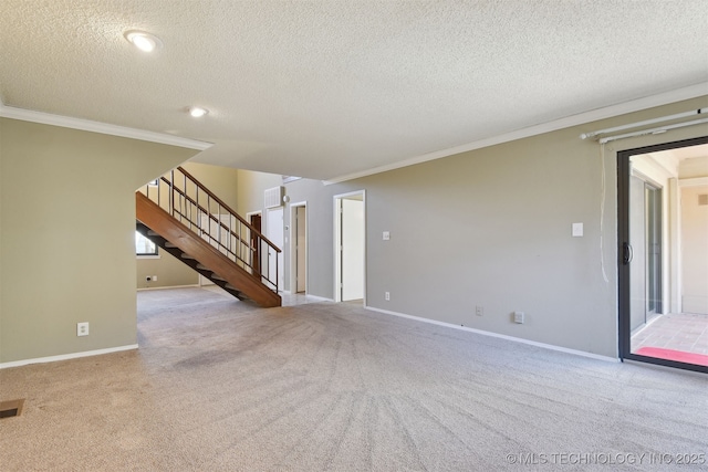 unfurnished living room with ornamental molding, light carpet, and a textured ceiling