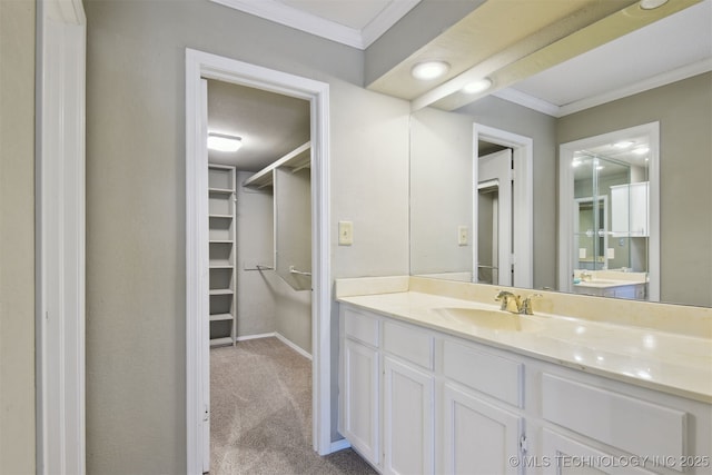 bathroom featuring ornamental molding and vanity