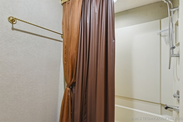 bathroom with shower / bath combination with curtain