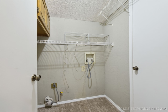 washroom with cabinets, hookup for a washing machine, carpet flooring, and a textured ceiling