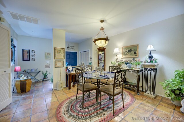 dining space with light tile patterned floors