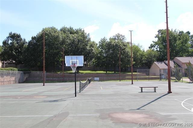 view of basketball court featuring community basketball court and fence