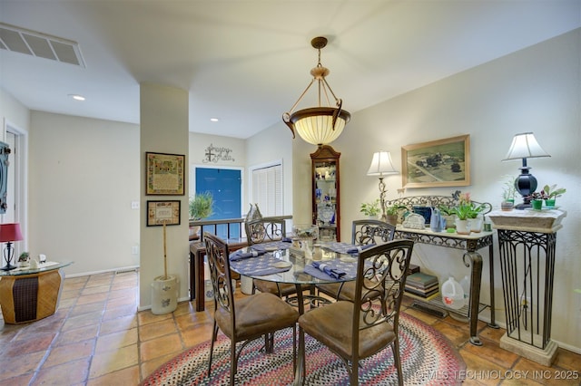 tiled dining area featuring recessed lighting, visible vents, and baseboards