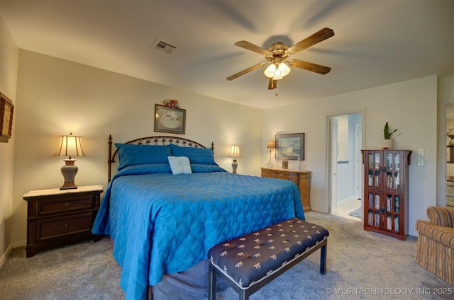 carpeted bedroom featuring ceiling fan and visible vents