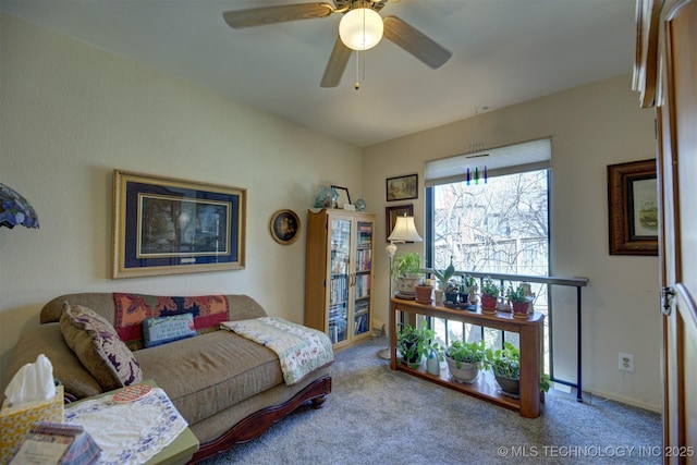 carpeted living room featuring ceiling fan