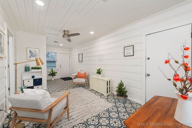 sunroom / solarium with wood ceiling and ceiling fan