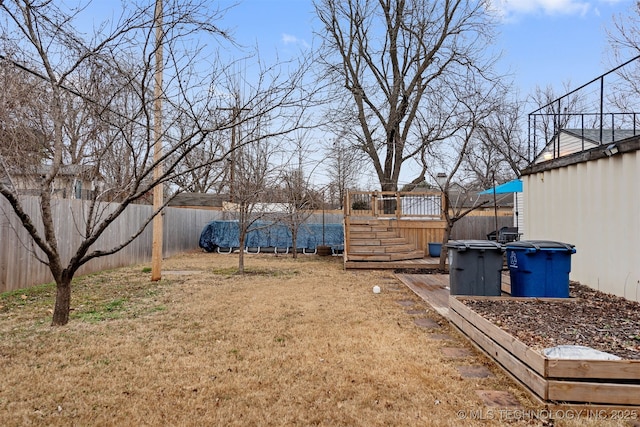 view of yard with a wooden deck