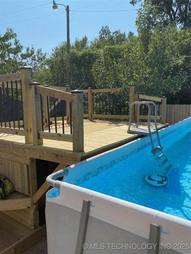 view of pool featuring a wooden deck