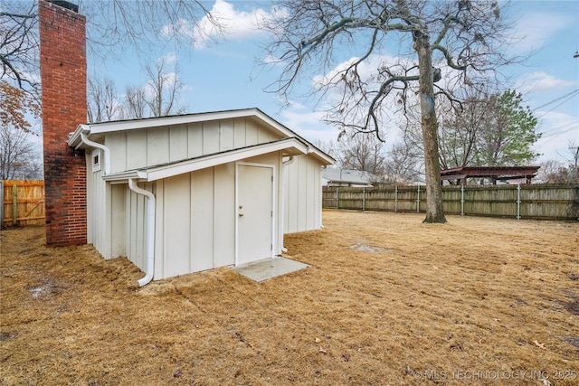 view of outdoor structure with a lawn