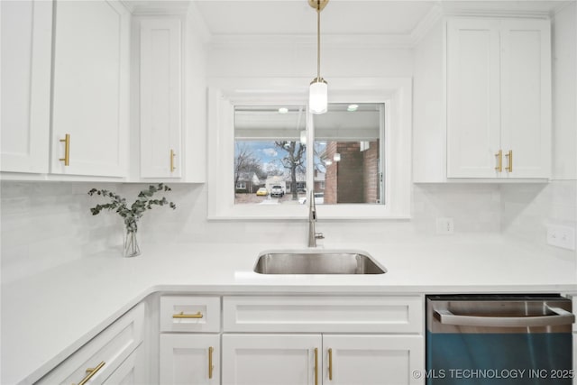 kitchen featuring sink, dishwasher, tasteful backsplash, white cabinets, and decorative light fixtures