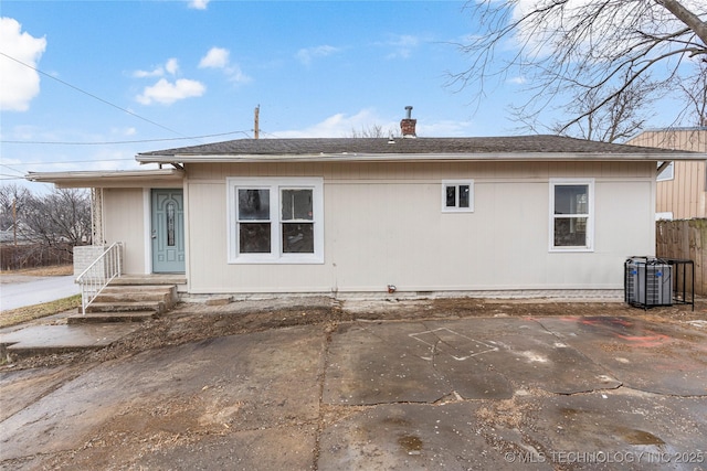 back of property with a patio and cooling unit