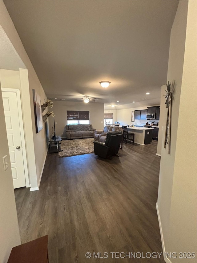 unfurnished living room featuring dark wood-type flooring