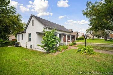 view of property exterior featuring a lawn