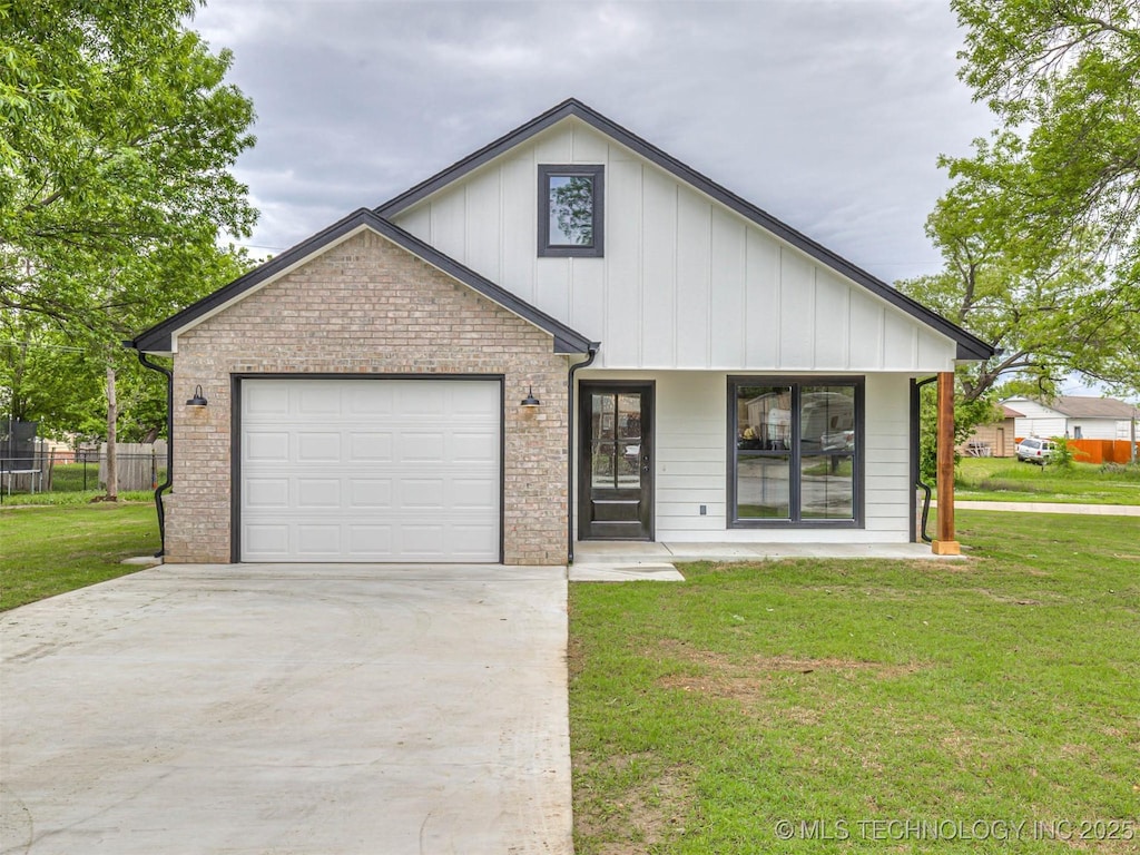 view of front of property with a garage, covered porch, and a front lawn