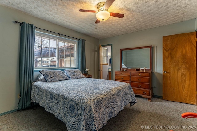 bedroom featuring ceiling fan, carpet floors, and a textured ceiling