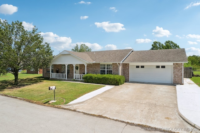 ranch-style home with a garage, covered porch, and a front lawn