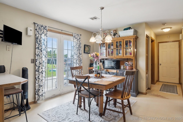 dining space featuring a chandelier