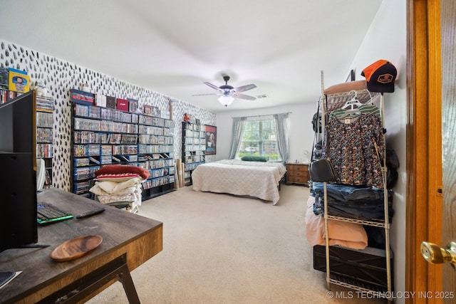 bedroom with ceiling fan and carpet floors