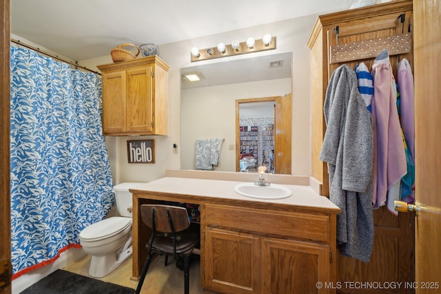 bathroom with vanity and toilet