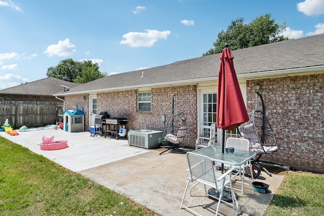 back of property with a patio area