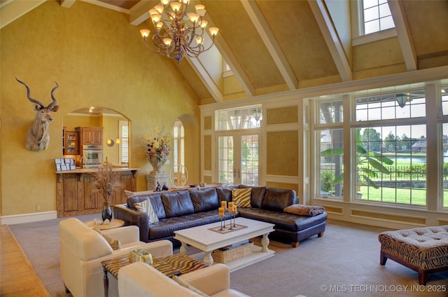 living room with beam ceiling, carpet floors, and high vaulted ceiling