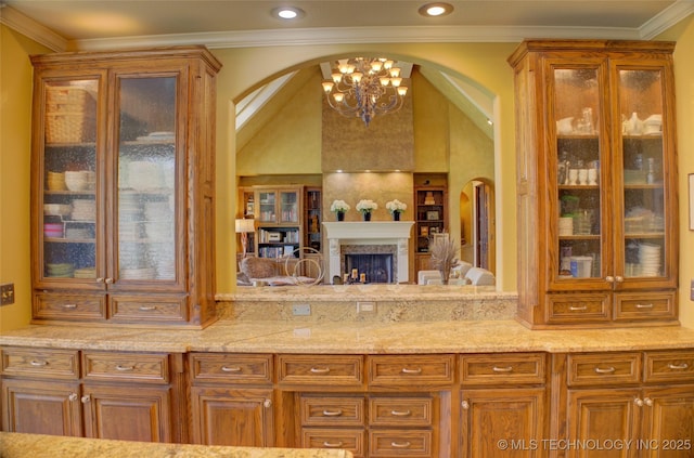 kitchen featuring crown molding and vaulted ceiling