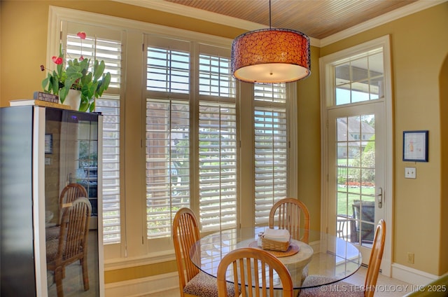 tiled dining room with crown molding