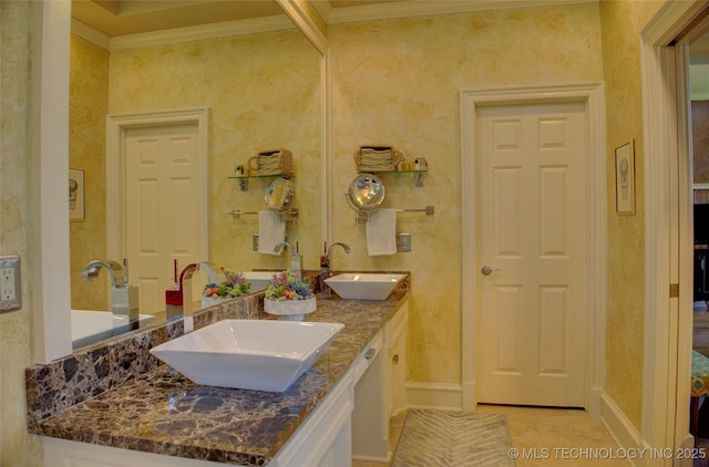 bathroom featuring crown molding and vanity